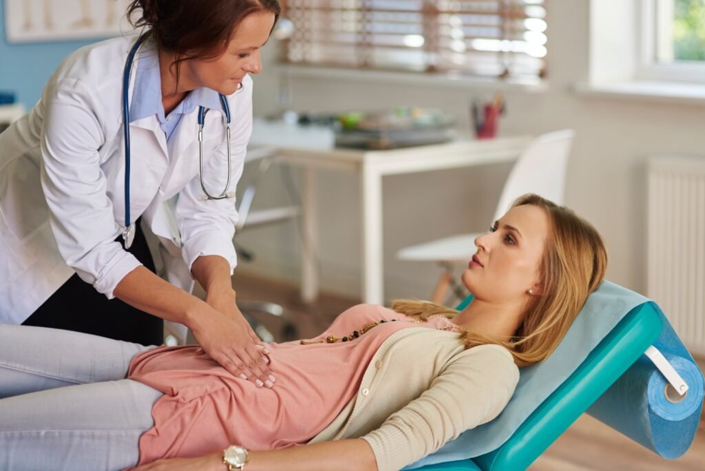 Dr. Rehan Bin Asif at The Women's Care Clinic Lahore consulting a patient for gynecology and obstetrics care.